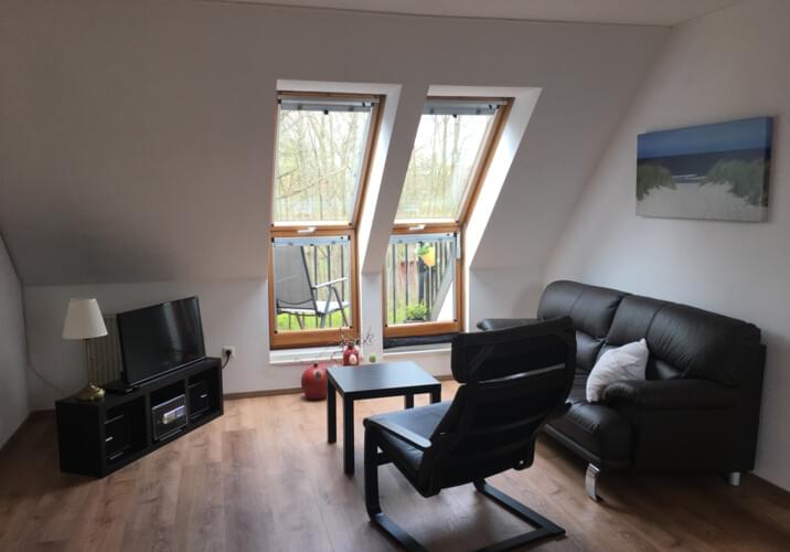 Wohnzimmer mit Balkon