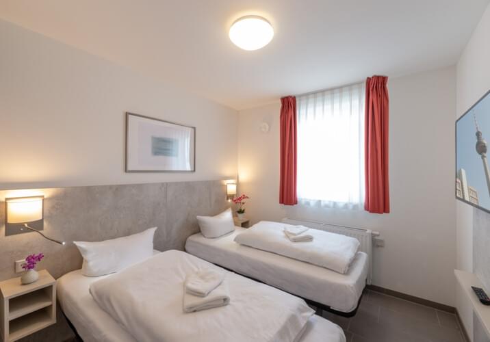 Zweibett-Zimmer im Apartment