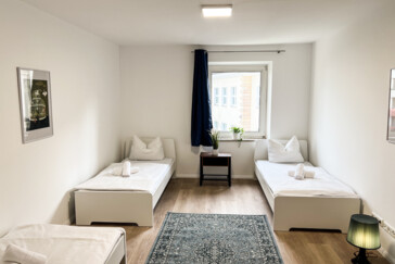 Schlafzimmer mit drei Einzelbe